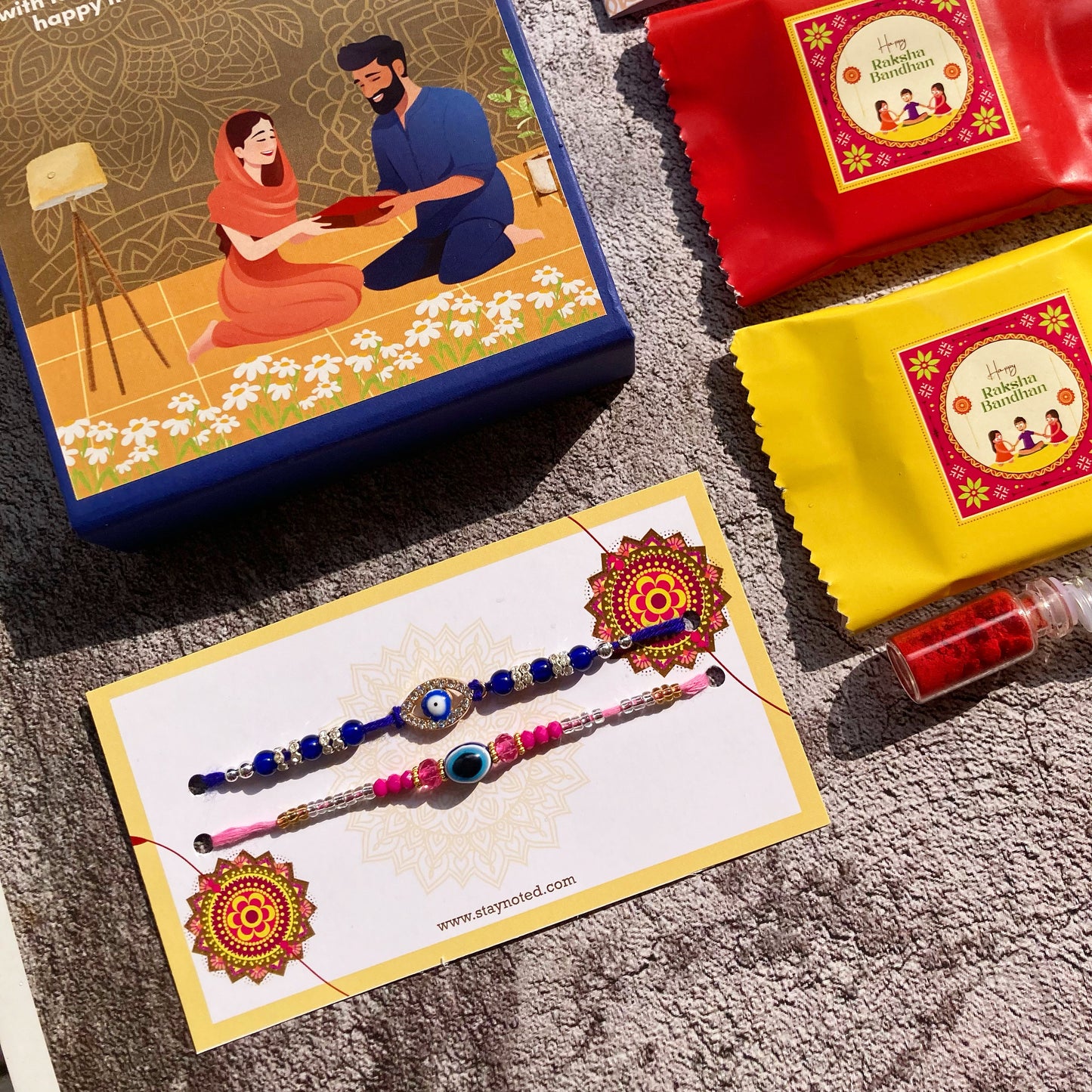 Bhai and Bhabhi Evil Eye Rakhi | Magnetic Gift Box, Chocolate, Card, Roli & Chawal
